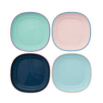 Four colorful square plates on a white background