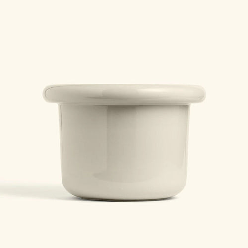 Glossy polar white ceramic planter with a wide lip and rounded edges, perfect for modern home decor.