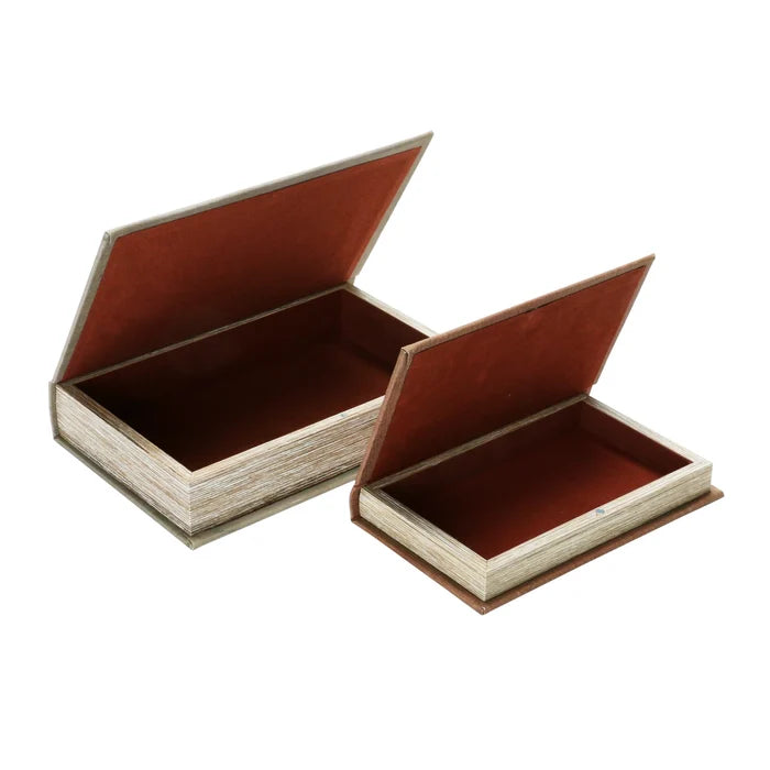 Two decorative storage boxes designed to look like books with brown interior lining and textured cover edges.