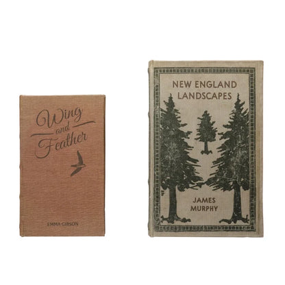 Two hardcover books side by side, one with "Wing and Feather" title and bird illustration, the other with trees and "New England Landscapes" title